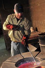 Molten aluminum is skimmed prior to a pour